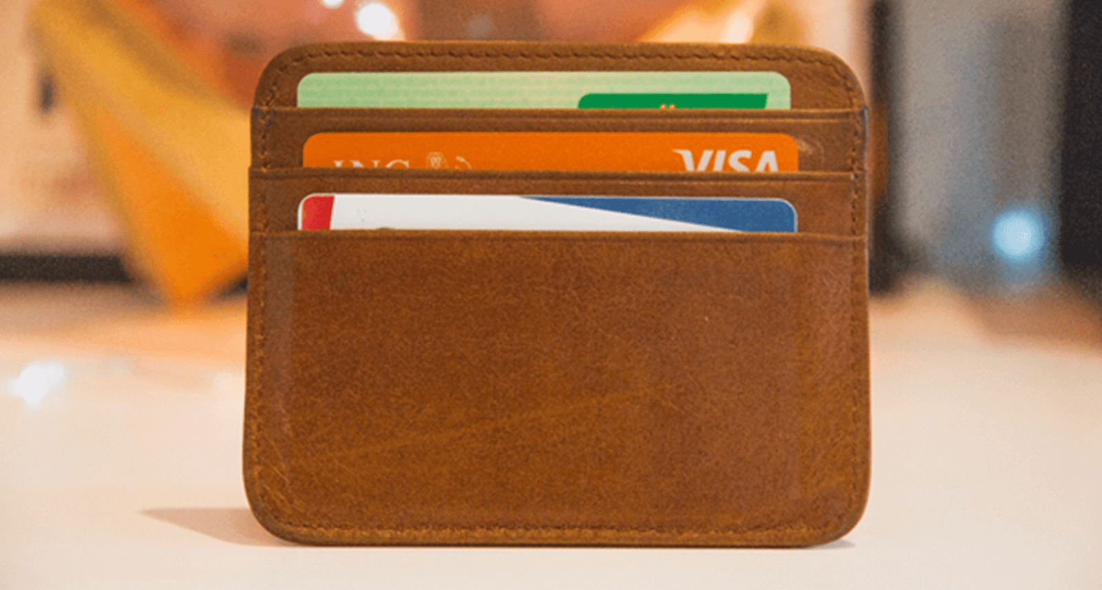 A wallet with bank cards and credit cards in it